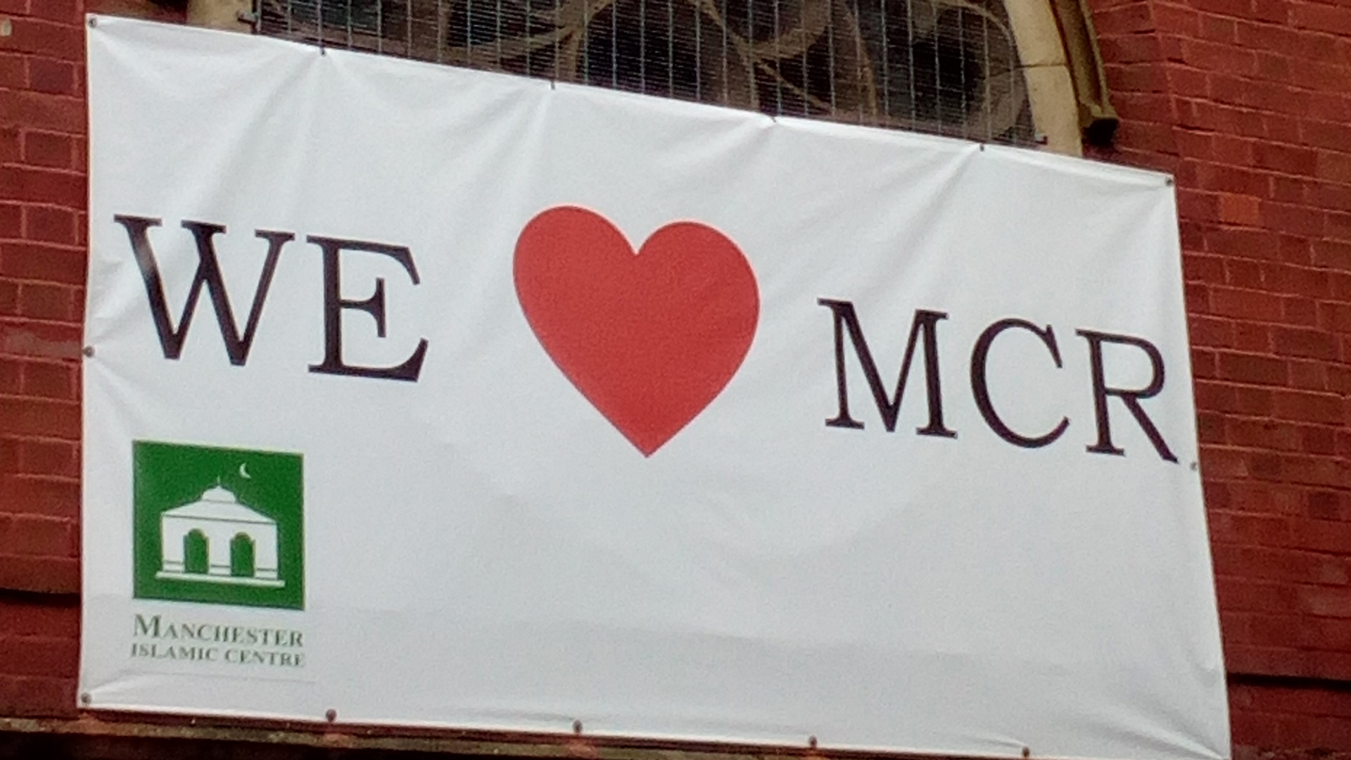 A 'We love Manchester' sign hanging on the Didsbury Mosque, where the Manchester Arena bomber Salman Abedi had worshipped. 