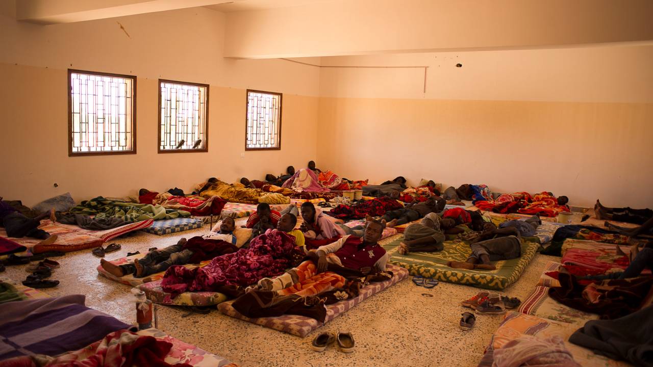 Migrants held in Libya can face horrendous conditions. They may be held in prison camps, and guards may beat them in a bid to extort money from their relatives back home for their release. 